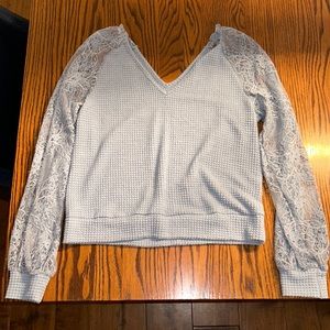 Size L light blue sweater with lace sleeves never worn